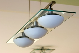 A modern light fixture hanging from the ceiling