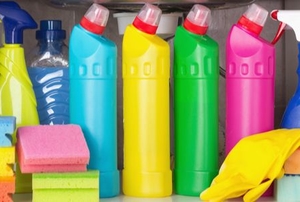 colorful cleaning products under a kitchen sink