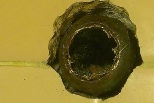 A slip-nut frozen onto a broken pipe.