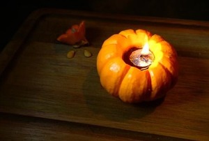 A mini pumpkin olive oil lamp for Thanksgivukkah.