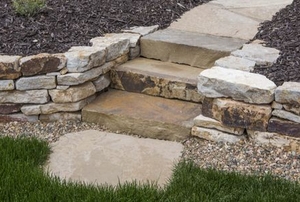 Landscaping stones in pathway and low wall