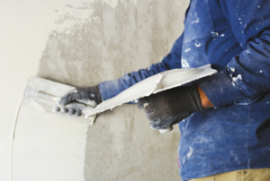 Man plastering a wall