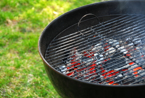 charcoals flaming in a barbeque grill