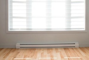 A baseboard heater painted white.
