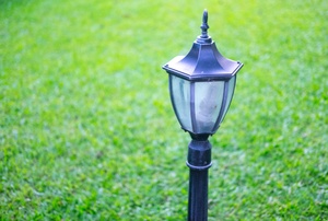 Lamp post with grass in the background