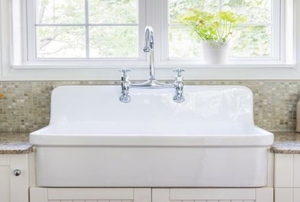 white kitchen sink and white cabinets