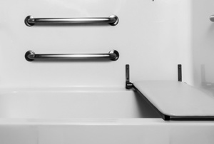 bath tub with accessibility bars and board