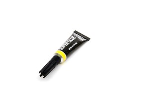 An isolated black tub of generic super glue.