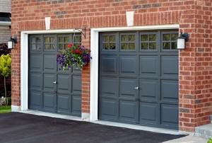 Double garage with brick exterior