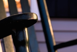 close-up of wooden rocking chair painted black