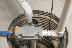 plastic pipes running into a basement drain
