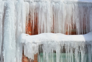 large icicles hanging from the side of a roof