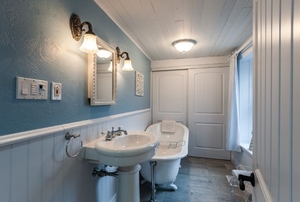 bathroom with a pedestal sink