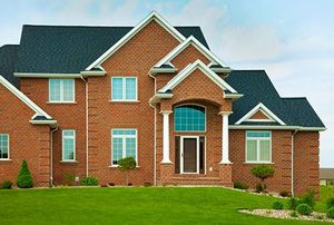 Large Red Brick House With Spring Green Yard