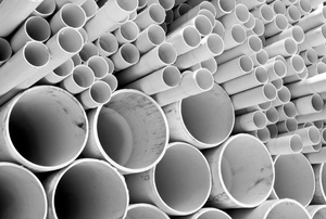 A stack of white cpvc pipe.