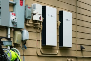Tesla home batteries on exterior wall