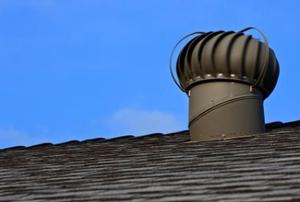 An mushroom-shaped air vent on a roof.