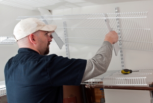 Man installing wire shelving