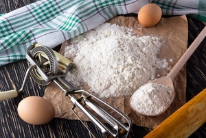 An egg beater and other baking supplies.