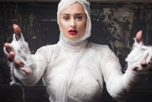 a woman in a mummy costume