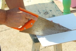 hand slicing tile with a panel hacksaw