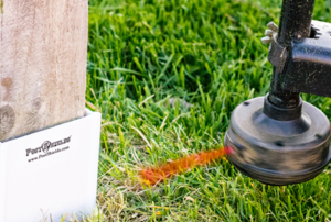 Weed trimmer hitting post with Post Shields attached.