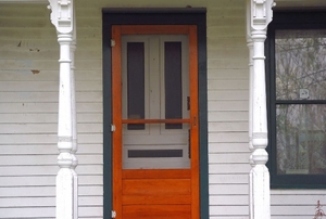 A painted metal screen door.