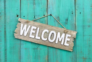 A wooden sign on a door.