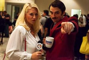 A couple dressed as the characters from the movie Anchorman.