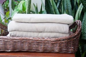 folded towels in a basket