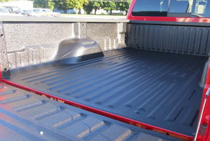 red truck with a sprayed in bed liner