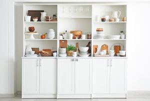white shelving cabinet unit with displayed items