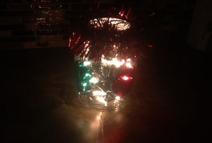A mason jar with Christmas lights.