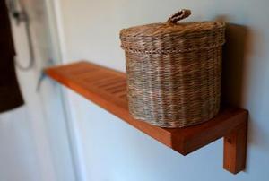 A wicker basket on a shelf.