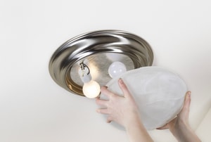 Removing the cover from a light fixture