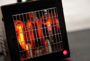 Radiant space heater with warm coils