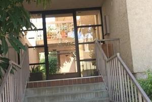 The outside of the condo building.