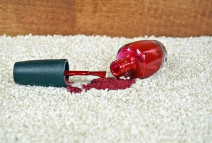 A nail polish stain on carpet.