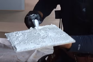 Applying grout to tile