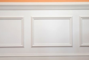 wainscotting panels on a peach colored wall