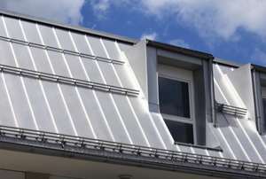 standing seam metal roof with two windows