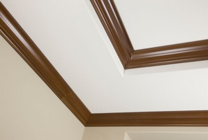The corner of a ceiling with double crown molding.