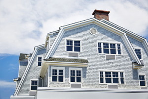Large home with a hip truss roofline