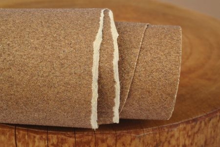 A torn roll of sandpaper