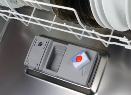 A dishwasher soap dispenser