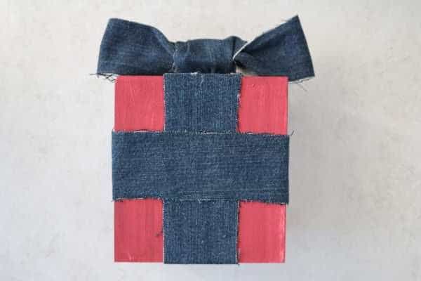 A red box with a denim bow. 