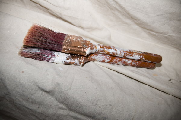 drop cloth and paint brushes