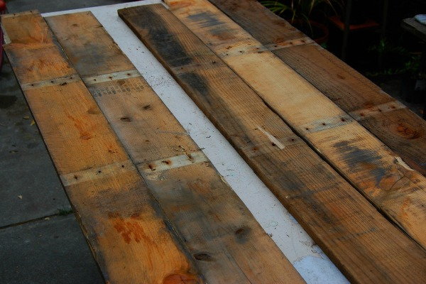 Upcycle Pallets Into A Wood Floor Doityourself Com