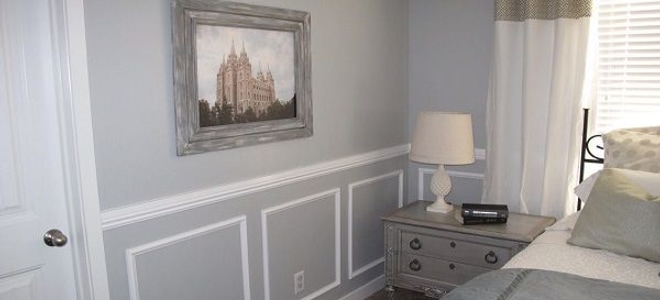 master bedroom with two-tone wainscoting