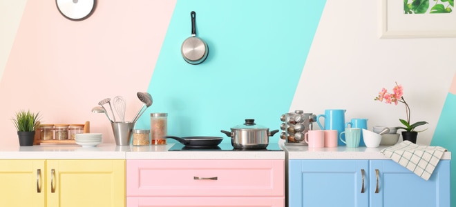 A yellow, pink and blue kitchen.
